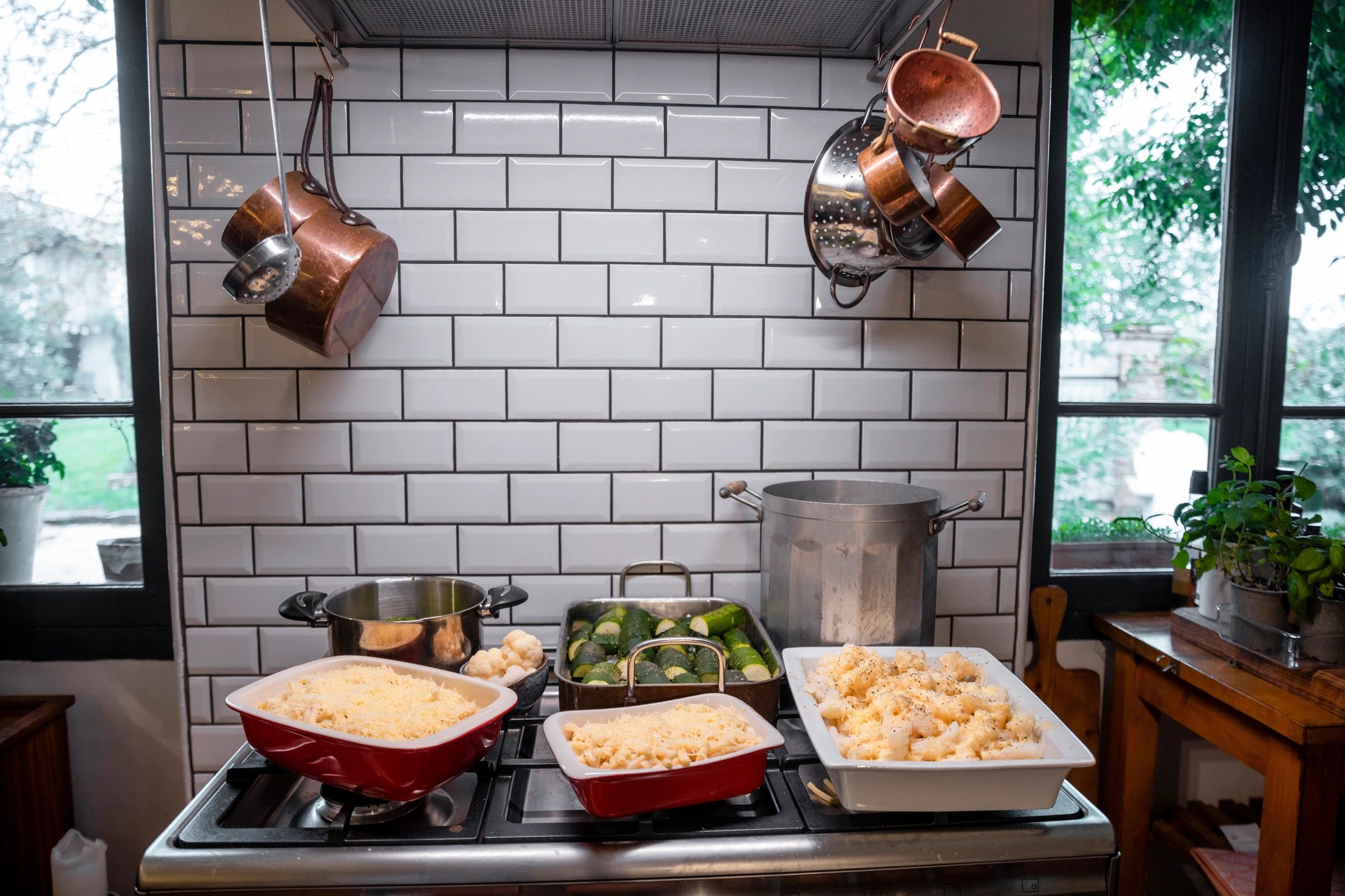 Several pots cooking on the stove for a budget-friendly family meal